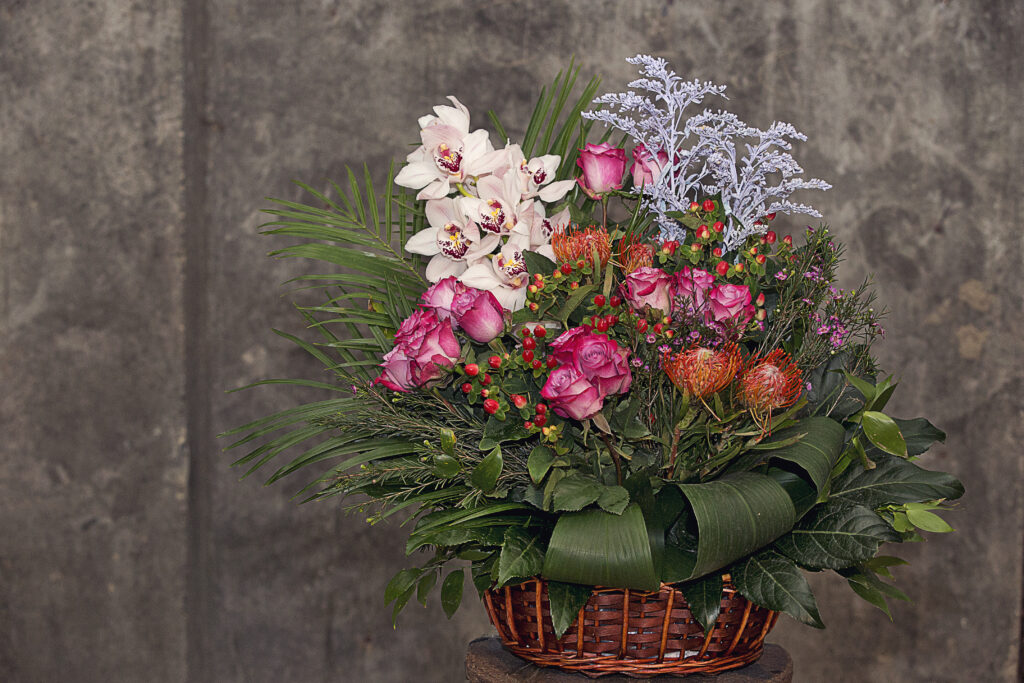 mixed flower bouquet inside bamboo basket