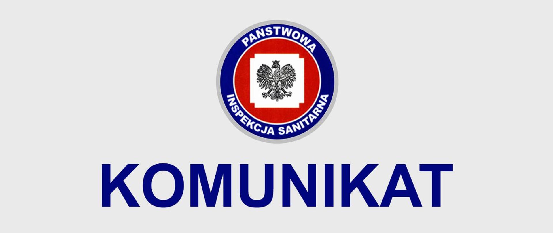 Logo Państwowej Inspekcji Sanitarnej na szarym tle, z czerwono-niebieskim okręgiem i białym orłem. Pod spodem duży, niebieski napis KOMUNIKAT.